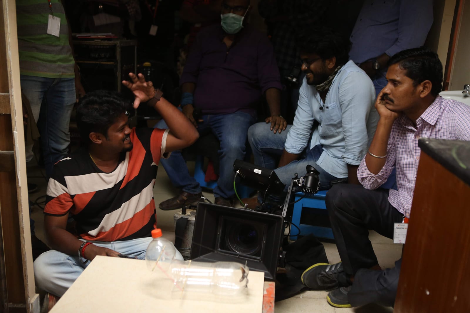 Camera and crew packed into a tight location