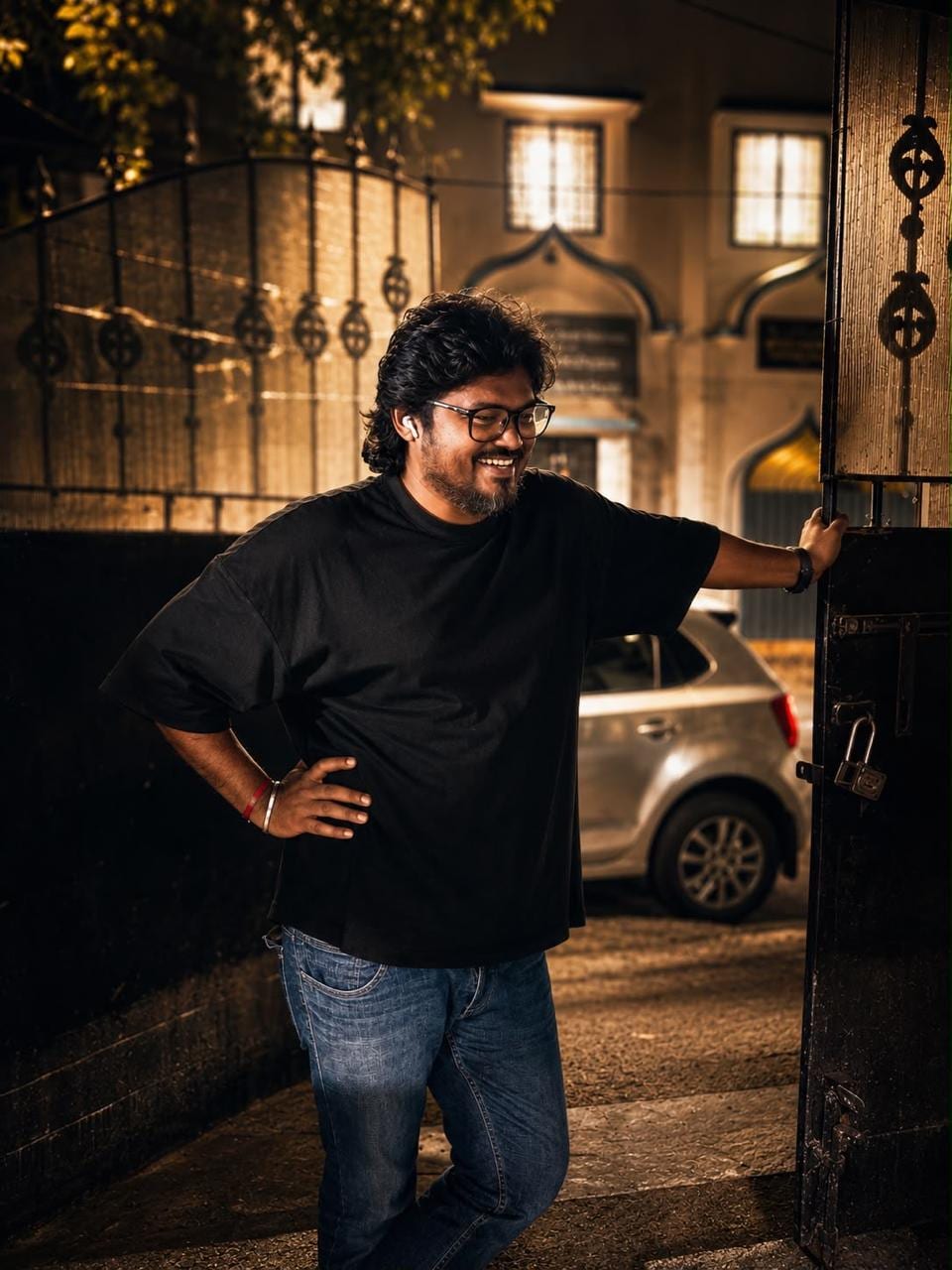 Siva Sankar at a lit gateway on a Wedo Creative street set